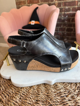 Black open-toe sandals with cork sole. Corkys Carley Wedges in black crackle